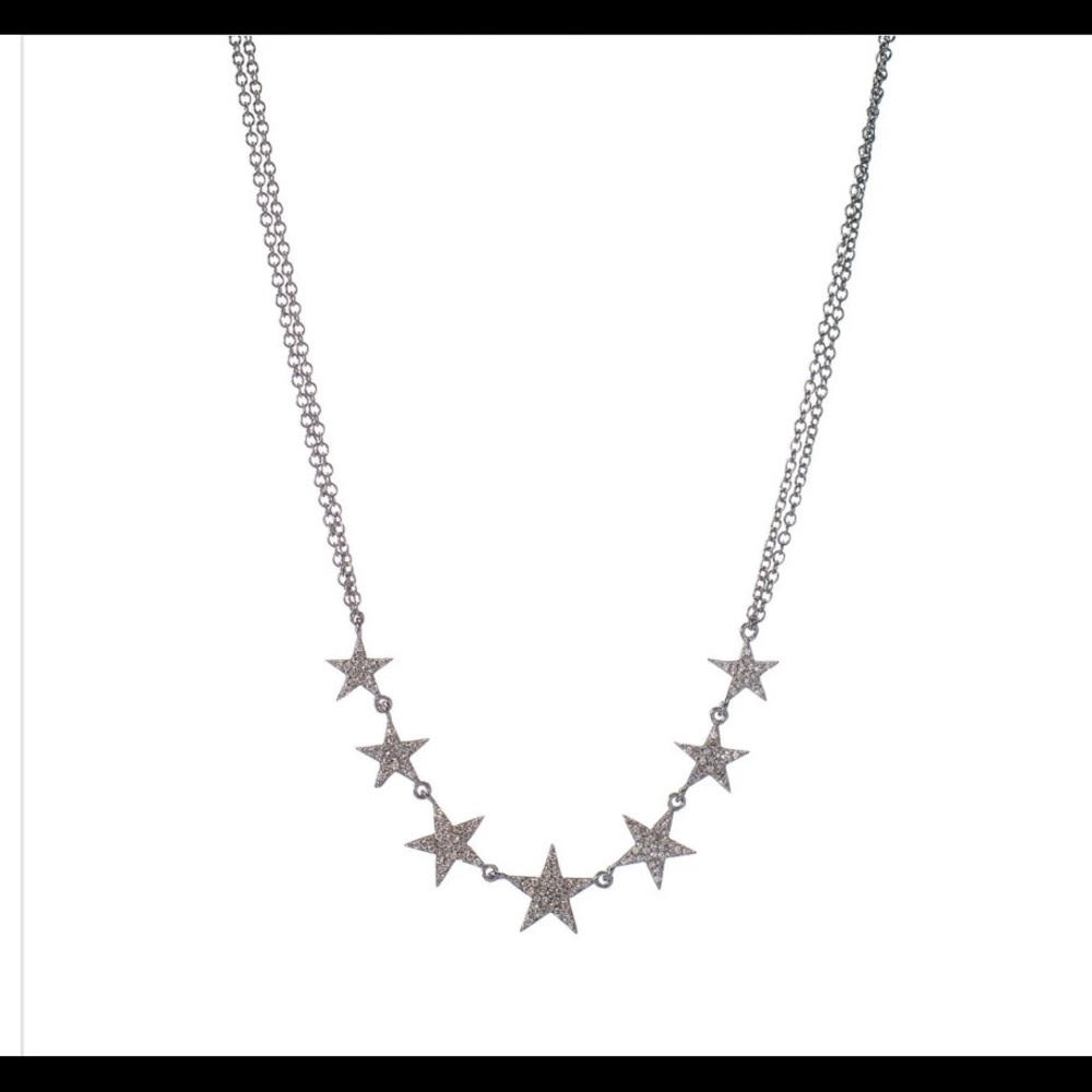 Pave diamond stars necklace. Rhodium plated sterling silver. Adjustable chain.